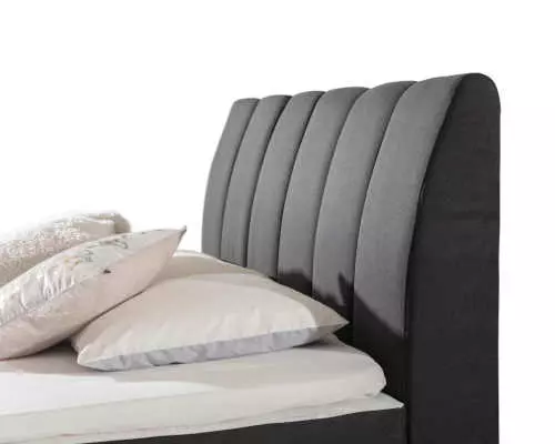 Čalúnená posteľ v elegantnom dizajne